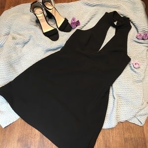 Black cocktail dress with detail lace on the back.